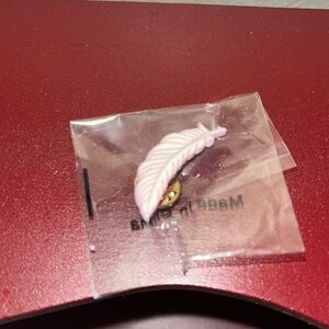 pink and white feather pin